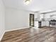 An updated kitchen with white cabinets, stainless steel appliances, and wood-look floors at 116 Ridgewood Dr, York, SC 29745