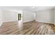 Spacious living room features modern wood-look flooring and ample natural light at 116 Ridgewood Dr, York, SC 29745