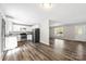 Open-concept view of a kitchen that flows into a living room with wood-look flooring at 116 Ridgewood Dr, York, SC 29745