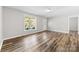 Bright living room featuring wood-look floors and a large window at 116 Ridgewood Dr, York, SC 29745