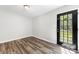 Small room with hardwood floors and access to outside deck at 116 Ridgewood Dr, York, SC 29745