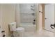 Clean bathroom featuring a tiled shower, a shower curtain and tile flooring at 116 Whispering Cove Ct, Mooresville, NC 28117
