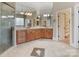 This primary bathroom is complete with double sinks, a glass shower and a walk-in closet at 116 Whispering Cove Ct, Mooresville, NC 28117