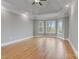 This primary bedroom offers hardwood floors, a tray ceiling and large windows at 116 Whispering Cove Ct, Mooresville, NC 28117