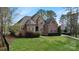 Elegant home featuring a stone and brick facade and manicured landscaping at 116 Whispering Cove Ct, Mooresville, NC 28117