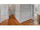Hallway with hardwood floors, molding and a view of the entryway at 116 Whispering Cove Ct, Mooresville, NC 28117