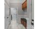 Hallway features tile flooring, wainscotting, and a wooden bench with cabinets at 116 Whispering Cove Ct, Mooresville, NC 28117