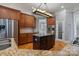 Beautiful kitchen features an island, stainless steel appliances, granite countertops, and wood cabinets at 116 Whispering Cove Ct, Mooresville, NC 28117