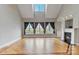 Bright living room with vaulted ceilings, fireplace, and hardwood floors at 116 Whispering Cove Ct, Mooresville, NC 28117