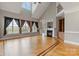 Bright living room with vaulted ceilings, fireplace, and hardwood floors at 116 Whispering Cove Ct, Mooresville, NC 28117