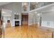 Spacious open-plan living room with a fireplace and hardwood floors at 116 Whispering Cove Ct, Mooresville, NC 28117