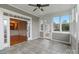Open sunroom with neutral tile flooring and many windows to let the light in at 116 Whispering Cove Ct, Mooresville, NC 28117