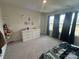 Bedroom with carpet floor, large window, dark curtain and dresser at 120 Parson Ln, Statesville, NC 28625