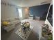 Upstairs bonus room or play area, complete with window, wall decor and furniture at 120 Parson Ln, Statesville, NC 28625