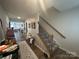 Inviting entryway with wood floors, stairs, decor and views into other living spaces at 120 Parson Ln, Statesville, NC 28625