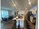 Bright kitchen with a center island, dark appliances, light cabinets and open floor plan at 120 Parson Ln, Statesville, NC 28625
