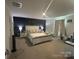 Spacious main bedroom features stylish accent wall, carpeted floor, and natural light at 120 Parson Ln, Statesville, NC 28625