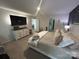 Bright main bedroom boasts a large bed, dresser, and open doorways at 120 Parson Ln, Statesville, NC 28625