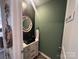 Stylish powder room with a decorative mirror and black sink at 120 Parson Ln, Statesville, NC 28625