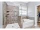 Modern bathroom featuring both a glass enclosed shower and a soaking tub for a luxurious experience at 1224 Horsesugar Rd, Clover, SC 29710