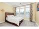 Bright and inviting bedroom featuring three large windows, filling the room with natural light and warmth at 1224 Horsesugar Rd, Clover, SC 29710