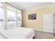 Well-lit bedroom featuring three windows, natural light, and neutral walls, creating a warm and inviting space at 1224 Horsesugar Rd, Clover, SC 29710