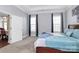 Light and airy bedroom with ensuite bathroom access, creating a cohesive and private living space at 1224 Horsesugar Rd, Clover, SC 29710