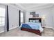 Comfortable bedroom features soft lighting, a tray ceiling, and a serene color scheme for a relaxing retreat at 1224 Horsesugar Rd, Clover, SC 29710