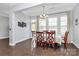 Elegant dining room with ample natural light, detailed trim and moldings, perfect for Gathering meals and special occasions at 1224 Horsesugar Rd, Clover, SC 29710