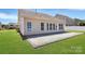 The back of the house features a patio, a door and many windows at 1224 Horsesugar Rd, Clover, SC 29710