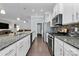 Modern kitchen with granite countertops, stainless appliances, and seamless flow into the living and dining areas for entertaining at 1224 Horsesugar Rd, Clover, SC 29710