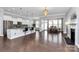 Open-concept living area featuring a modern kitchen, dining area, and fireplace, perfect for entertaining and Gathering gatherings at 1224 Horsesugar Rd, Clover, SC 29710