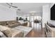 Spacious open-concept living area with hardwood floors, modern lighting, and seamless flow to the kitchen at 1224 Horsesugar Rd, Clover, SC 29710