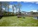 Well-maintained backyard features a play set with a slide and climbing wall at 136 Morgans Branch Rd, Belmont, NC 28012