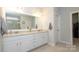 Bright bathroom with double vanity, granite counters, and a large mirror, creating a luxurious feel at 136 Morgans Branch Rd, Belmont, NC 28012