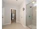Bright and spacious bathroom featuring a glass-enclosed shower and neutral tile at 136 Morgans Branch Rd, Belmont, NC 28012