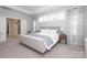 Bright bedroom with large bed, stylish curtains, and natural light from multiple windows at 136 Morgans Branch Rd, Belmont, NC 28012