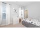 Bright bedroom with white walls, neutral carpet, a large window and a twin sized bed at 136 Morgans Branch Rd, Belmont, NC 28012