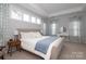 Spacious bedroom features tray ceilings, lots of natural light, and a serene, welcoming atmosphere at 136 Morgans Branch Rd, Belmont, NC 28012