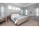 Spacious bedroom features tray ceilings, lots of natural light, and a serene, welcoming atmosphere at 136 Morgans Branch Rd, Belmont, NC 28012