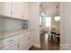 Butler's pantry with white cabinets and granite countertops, providing extra storage space at 136 Morgans Branch Rd, Belmont, NC 28012