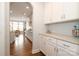 Butler's pantry with white cabinets and granite countertops, providing extra storage space at 136 Morgans Branch Rd, Belmont, NC 28012