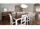Elegant dining room showcasing a large table and an eye-catching chandelier at 136 Morgans Branch Rd, Belmont, NC 28012