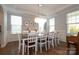 Elegant dining room showcasing a large table and an eye-catching chandelier at 136 Morgans Branch Rd, Belmont, NC 28012