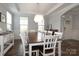 Elegant dining room showcasing a large table and an eye-catching chandelier at 136 Morgans Branch Rd, Belmont, NC 28012