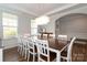 Elegant dining room showcasing a large table and an eye-catching chandelier at 136 Morgans Branch Rd, Belmont, NC 28012
