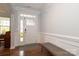 Bright foyer features wood floors, paneled walls, and a stylish front door at 136 Morgans Branch Rd, Belmont, NC 28012