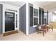 Inviting covered front porch with seating, perfect for enjoying the outdoors at 136 Morgans Branch Rd, Belmont, NC 28012