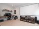 Modern home office with built-in desk, display shelf, movie screen, and ample space at 136 Morgans Branch Rd, Belmont, NC 28012