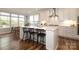 Bright kitchen featuring a large island, stainless appliances, white cabinetry, and many windows at 136 Morgans Branch Rd, Belmont, NC 28012